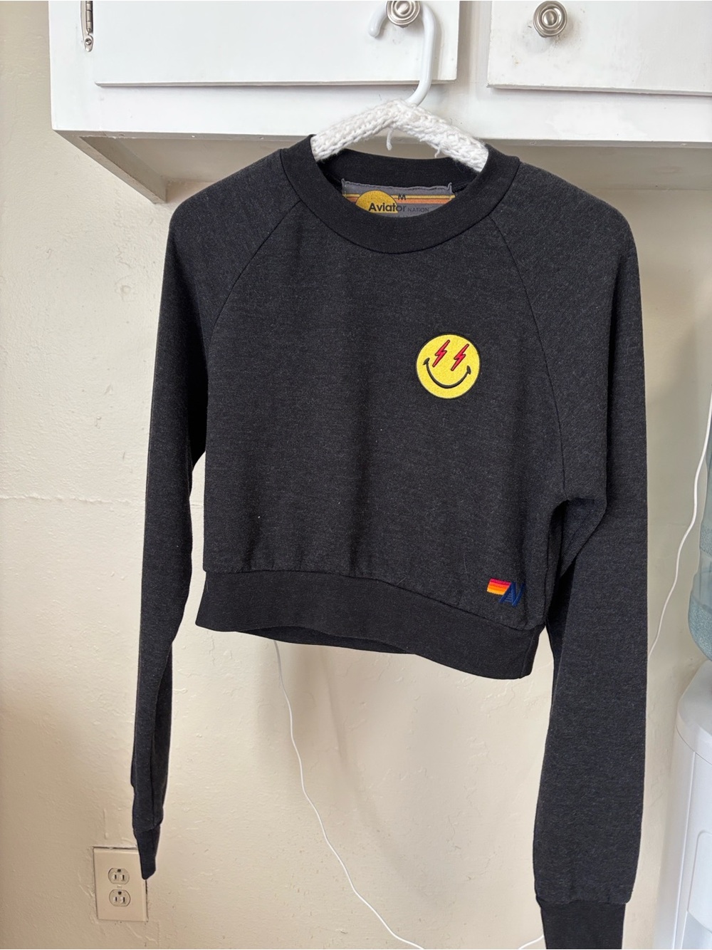 Aviator Nation Cropped Crewneck with Yellow smiley lightning bolt eyes patch